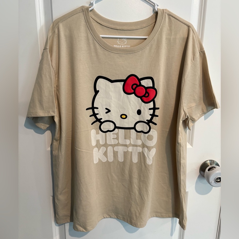 NWOT- Hybrid Apparel Hello Kitty woman’s logo shirt, cream color, size XL or XXL